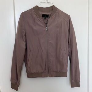 Taupe jacket. Zip up.